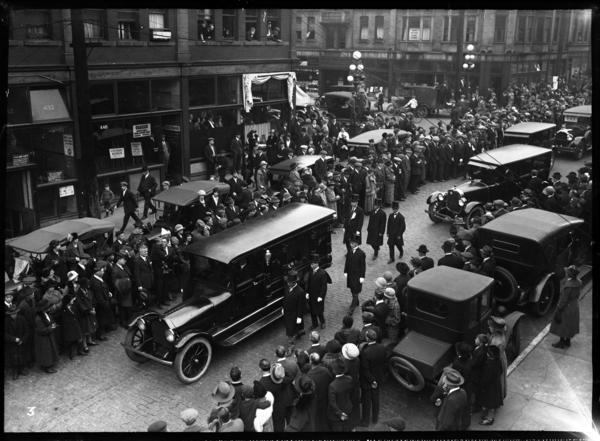 Original title:  From Vancouver Public Library. Funeral procession for David C. Lew. Number 3 of a series VPL 17714-17725. Victoria Block visible at cross street is at 342 Pender Street, Vancouver, B.C.
Date: October 25, 1924. Photographer/Studio: Thomson, Stuart.