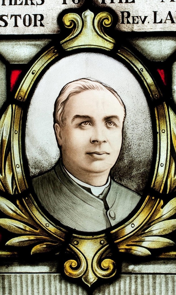 Original title:  Stained glass window featuring an image of Lancelot Minehan in St Vincent de Paul Church, Toronto.  Used with permission from St Vincent de Paul Parish, Toronto.