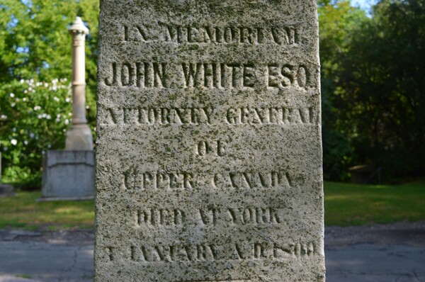 Original title:  Gravesite Of John White, Esquire / Ontario's 1st Attorney-General / Killed In A Duel .... St James Cemetery .... Toronto, Ontario. Source: https://www.flickr.com/photos/57156785@N02/52305872817 - photo from 
Greg's Southern Ontario on Flickr.