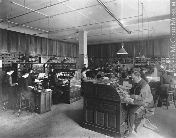 Original title:  Photograph Anson McKim's office, Montreal, QC, 1903 Wm. Notman & Son 1903, 20th century Silver salts on glass - Gelatin dry plate process 20 x 25 cm Purchase from Associated Screen News Ltd. II-145305 © McCord Museum Description Keywords:  A. McKim (1) , architecture (335) , card file (1) , clerical (1) , commercial (84) , figure (1849) , group (644) , interior (40) , Montreal (404) , Occupation (1110) , office (7) , Photograph (77678) , roll-top desk (1) , typewriter (1) , work (389) , work (126)